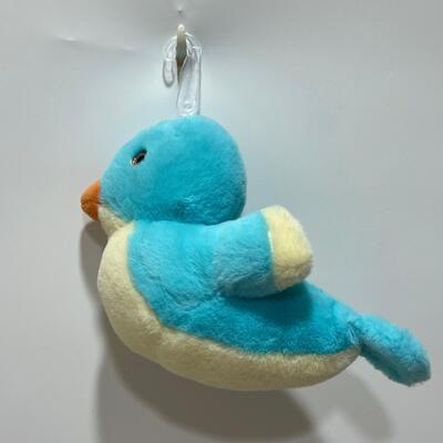 Giocattolo colorato per uccelli con bottoni in peluche per bambini e collezionisti